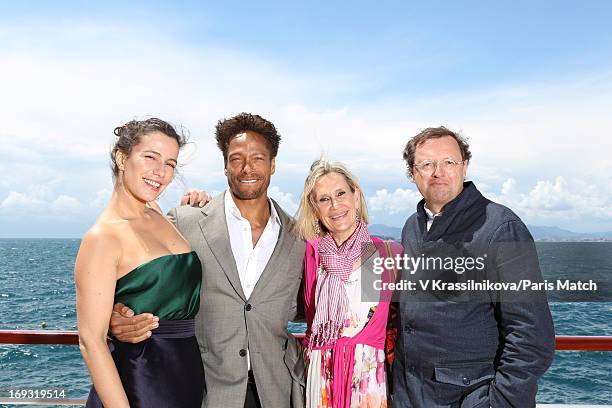 Actors Zoe Felix and Gary Dourdan, and PR director for Renault Claude Hugot and Isabelle Hugot are photographed for Paris Match on May 17, 2013 in...