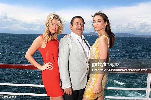 Jeweller Edouard Nahum is photographed with actor Jessica Morali and Isabella Orsini for Paris Match on May 17, 2013 in Cannes, France.