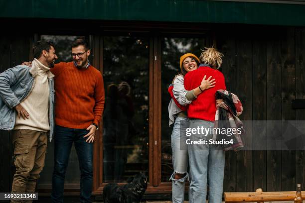 the joyous ambiance of a garden party, with a diverse group of people relishing a shared meal amidst nature's beauty - the party arrivals stock pictures, royalty-free photos & images