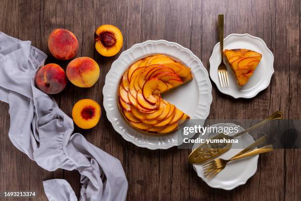 fresh peach tart with almond cream close-up on a wooden table - jam asia stock pictures, royalty-free photos & images