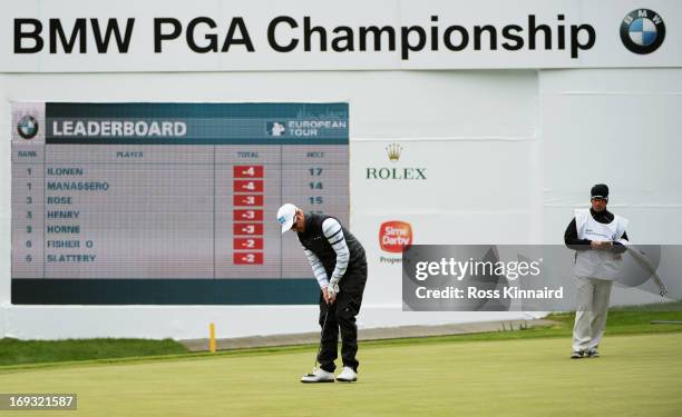 Mikko Ilonen of Finland holes out on the 18th green during the first round of the BMW PGA Championship on the West Course at Wentworth on May 23,...