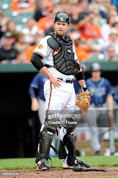 Chris Snyder of the Baltimore Orioles rests during a break in the game against the Tampa Bay Rays at Oriole Park at Camden Yards on May 19, 2013 in...