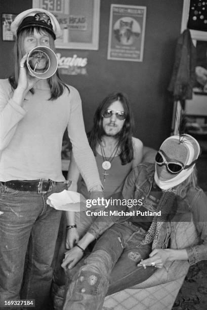 Dave Brock and Ian 'Lemmy' Kilmister, of space rock group Hawkwind, with a masked companion, 17th May 1973.