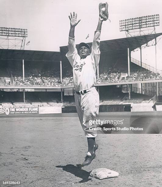 Brooklyn Dodger Jackie Robinson practices at first base at Ebbets Field in the Brooklyn borough of New York City.