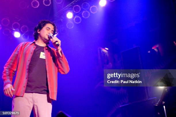 Colombian singer and guitarist Jorge Villamizar, from the Latin pop group Bacilos, performs on stage, Chicago, Illinois, May 20, 2003.