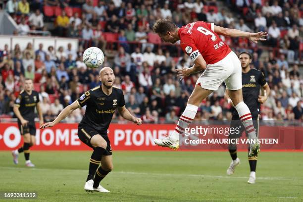 S Dutch forward Luuk de Jong Mexican heads the ball to score PSV's first goal during the Dutch Premier League Eredivisie football match between PSV...