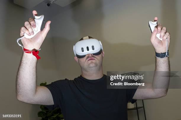 An attendee uses a Meta Platforms Inc. Quest 3 virtual reality headset during an event in San Francisco, California, US, on Sept. 18, 2023. Meta...