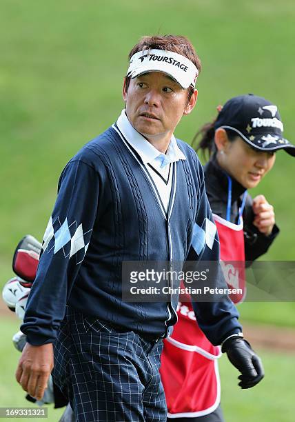 Joe Ozaki of Japan walks from the fourth hole tee box during Round One of the Senior PGA Championship presented by KitchenAid at Bellerive Country...