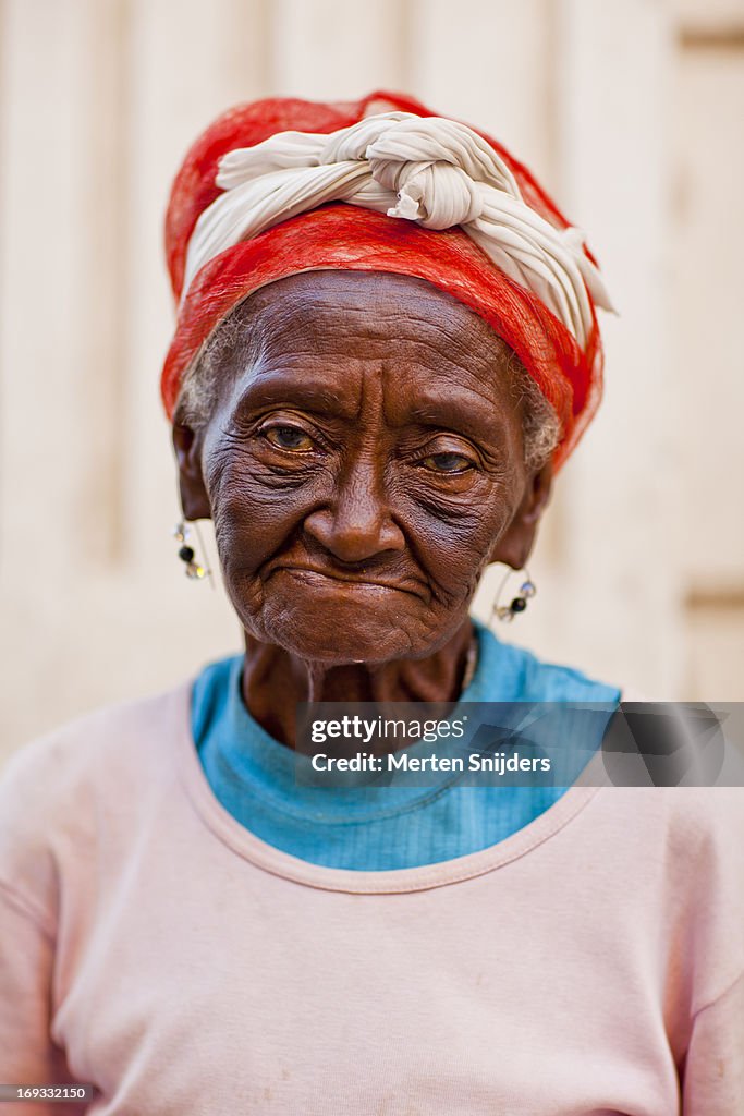 Cuban grandmother with red hair net