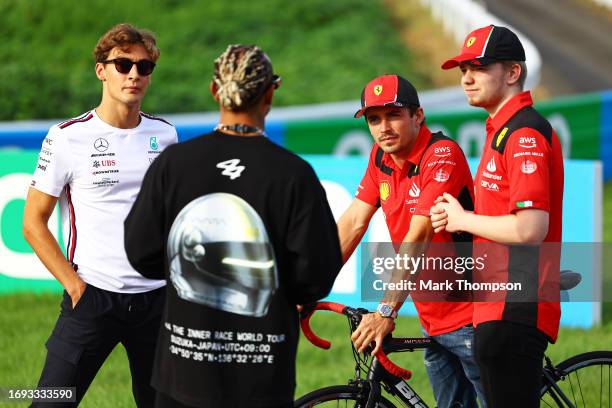 George Russell of Great Britain and Mercedes, Lewis Hamilton of Great Britain and Mercedes, Charles Leclerc of Monaco and Ferrari and Robert...