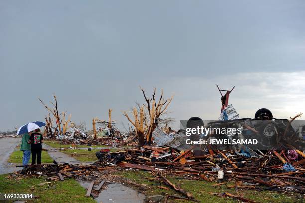 Tornado-devastated neighborhood is seen during a thunder storm on May 23, 2013 in Moore, Oklahoma. Severe thunderstorms barreled through this...