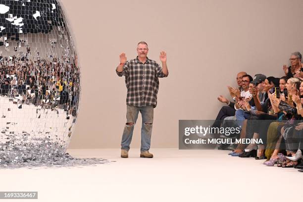 Swedish fashion designer Jonny Johansson acknowledges the audience at the end of the Acne Studios show during the Paris Fashion Week Womenswear...