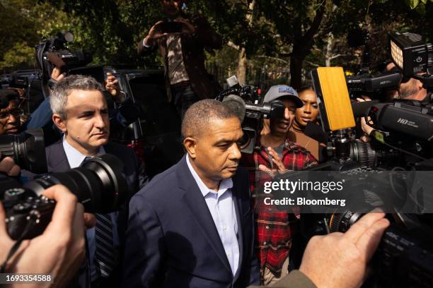 Jose Uribe, charged with conspiracy to commit bribery and conspiracy to commit honest services fraud, center, exits federal court in New York, US, on...