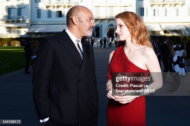 Christian Louboutin and Jessica Chastain attend amfAR's 20th Annual Cinema Against AIDS during The 66th Annual Cannes Film Festival at Hotel du...