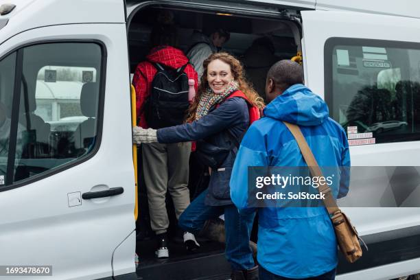 boarding the bus - vehilcles stock pictures, royalty-free photos & images