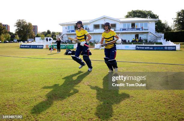 Alexa Stonehouse and Kira Chathli of South East Stars enter the pitch during the Rachael Heyhoe Flint Trophy match between The Blaze and South East...