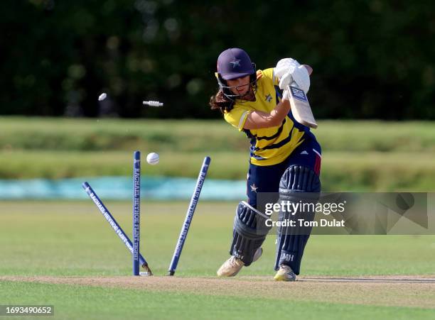 Kira Chathli of South East Stars is bowled during the Rachael Heyhoe Flint Trophy match between The Blaze and South East Stars at The County Ground...