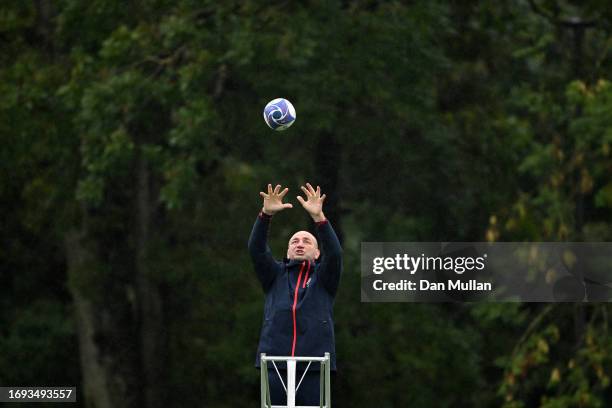 Steve Borthwick, Head Coach of England catches a lineout ball on top of a ladder during a training session at Stade Ferdinand Petit on September 21,...