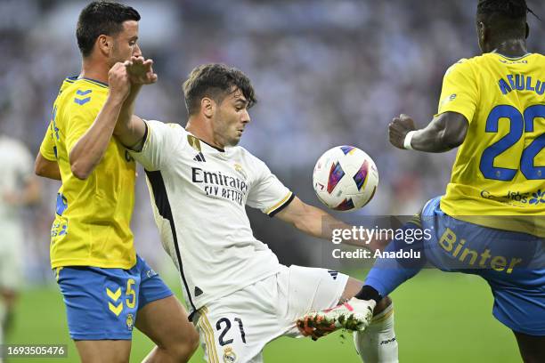 Brahim Diaz of Real Madrid and Javi Munoz of Las Palmas compete during the Spanish La Liga week 7 football match between Real Madrid and Las Palmas...