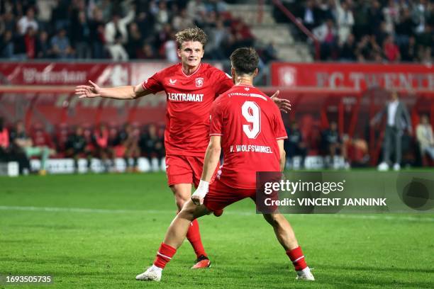 Twente's Sem Steijn is congratulated by teammate Ricky van Wolfswinkel after scoring a goal during the Dutch Eredivisie match between FC Twente and...