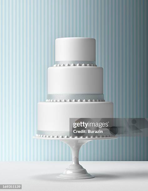 tiered fondant cake with blue background - wedding cakes stock pictures, royalty-free photos & images