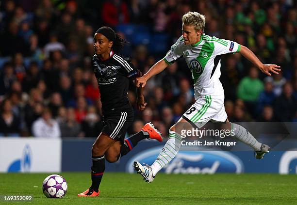 Elodie Thomis of Olympique Lyonnais comes under pressure from Ivonne Hartmann of VfL Wolfsburg during the UEFA Women's Champions League final match...