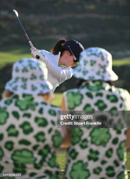 Leona Maguire of team Europe plays a shot infront of some Irish fans wearing shamrock design cloths during practice prior to the The Solheim Cup at...