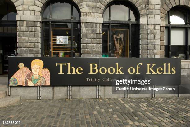 The Book of Kells banner advertising the outside the library of Trinity College in Dublin Ireland The oldest university in Ireland founded in 1592 by...