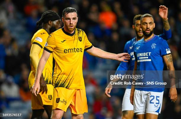 Livingston's Sean Kelly marks Kemar Roofe at a corner during a Viaplay Cup Quarter-final match between Rangers and Livingston at Ibrox, on September...