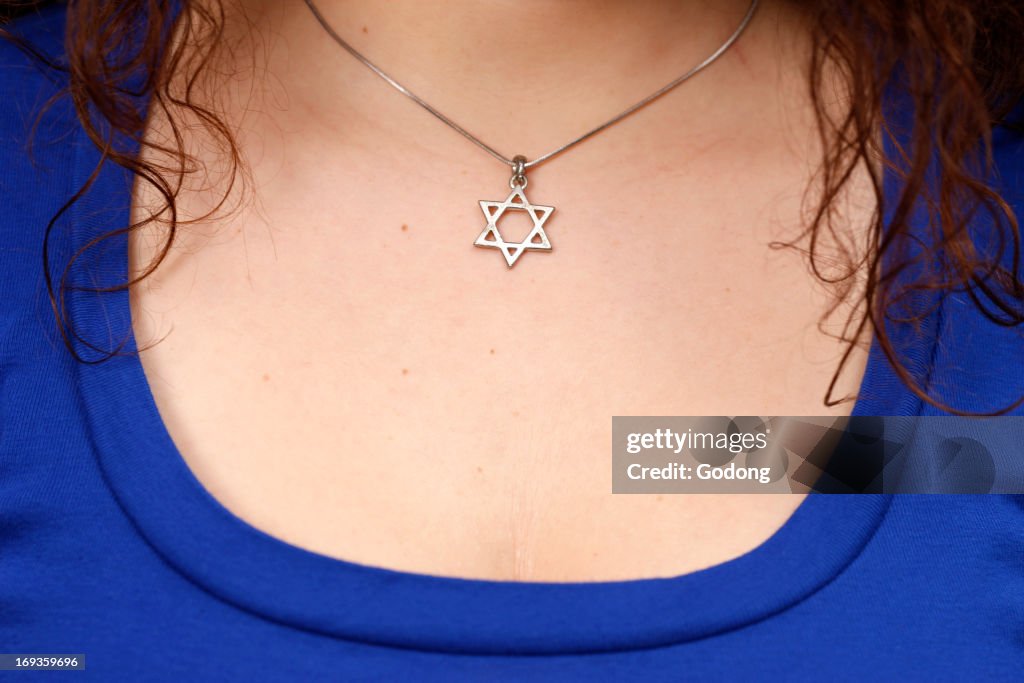 Young woman with a star of David necklace