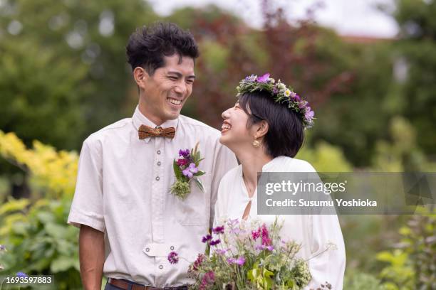 outdoor wedding photo of a young couple. - asian brides stock pictures, royalty-free photos & images