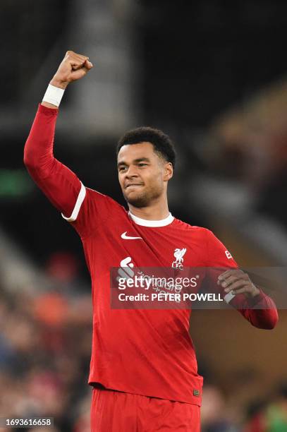Liverpool's Dutch striker Cody Gakpo celebrates after scoring his team first goal during the English League Cup third round football match between...
