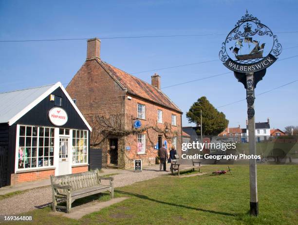 Village sign and shops Walberswick, Suffolk.