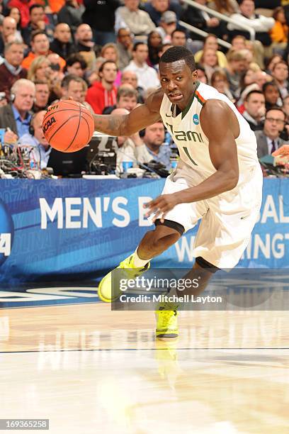 Durand Scott of the Miami Hurricanes dribbles the ball during the East Regional Round of the 2013 NCAA Men's Basketball Tournament game against the...