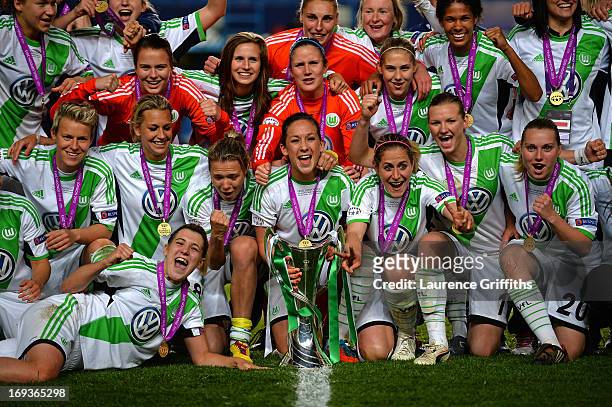 Nadine Kessler of VfL Wolfsburg and her team mates pose with the trophy after victory in the UEFA Women's Champions League Final Match between VfL...