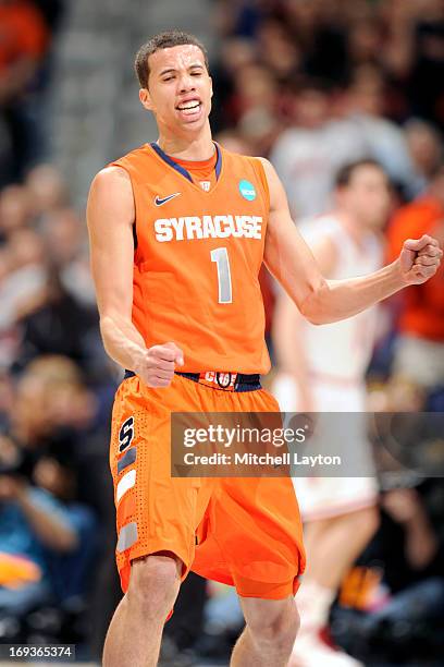 Michael Carter-Williams of the Syracuse Orange celebrates a shot during the East Regional Round of the 2013 NCAA Men's Basketball Tournament game...
