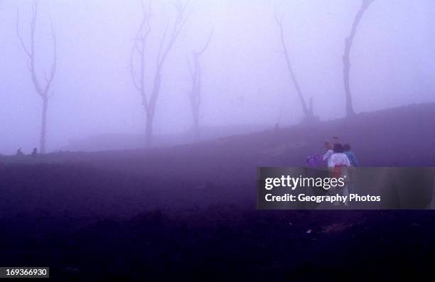 Adventure travel, people climbing active Pacaya volcano, Guatemala, Central America