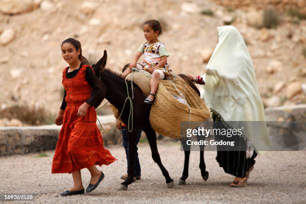 Family and donkey, Tunisia.