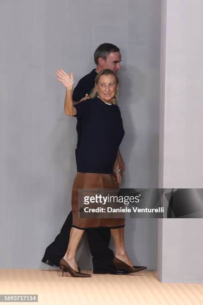 Fashion designers Miuccia Prada and Raf Simons walk the runway at the Prada fashion show during the Milan Fashion Week Womenswear Spring/Summer 2024...