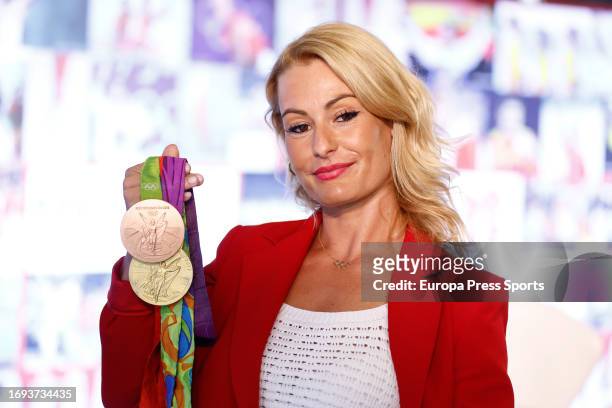 Lydia Valentin poses for photo during an event in which Lydia Valentin, Olympic Weightlifting Champion, announces her withdrawal from the Competition...