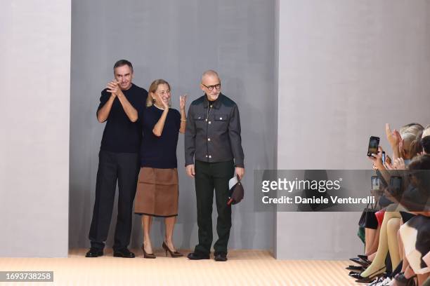 Fashion designers Miuccia Prada, Raf Simons and Fabio Zambernardi walk the runway at the Prada fashion show during the Milan Fashion Week Womenswear...