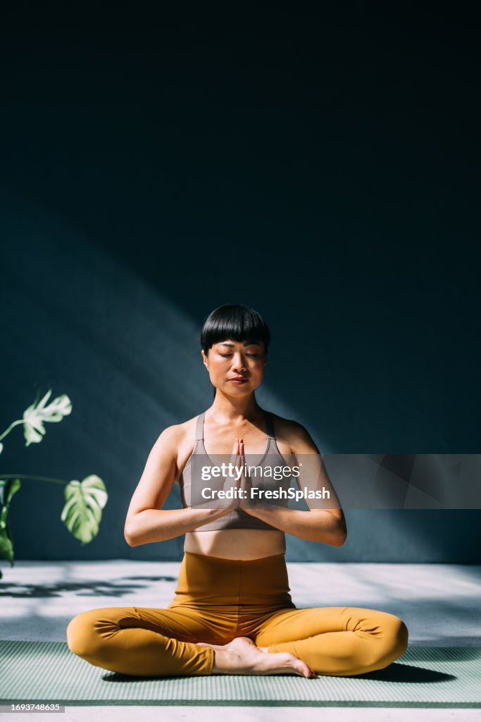 Japanese Woman Finding Serenity: Yoga for Mental Wellness