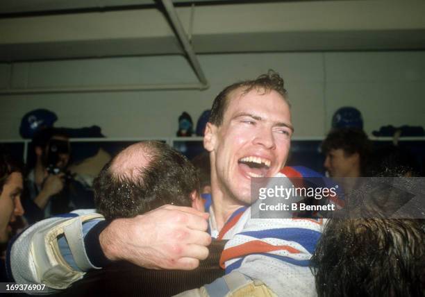 Mark Messier of the Edmonton Oilers celebrates in the locker room after the Oilers defeated the New York Islanders in Game 5 of the 1984 Stanley Cup...
