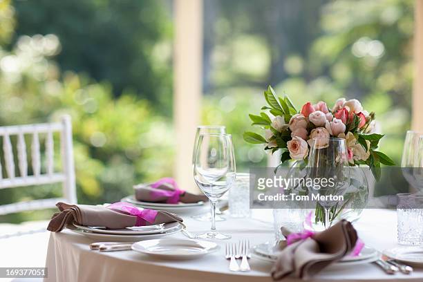close up of centerpiece at wedding reception - flower arrangement stock pictures, royalty-free photos & images