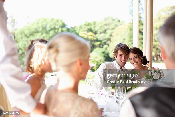 family celebrating at wedding reception - wedding party stock pictures, royalty-free photos & images
