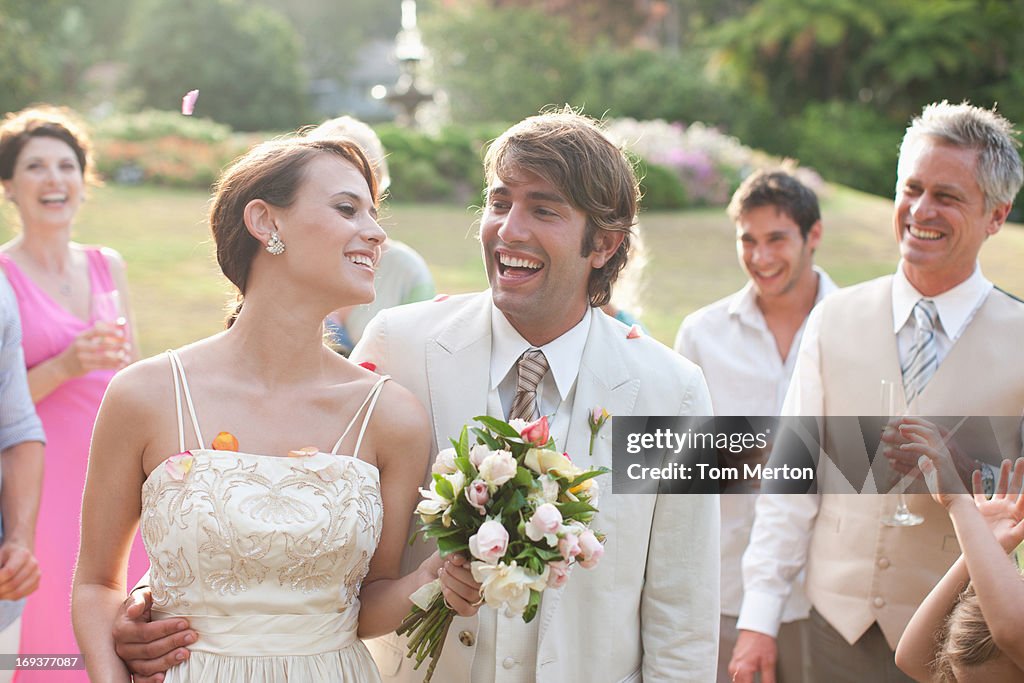 Guests watching bride and groom