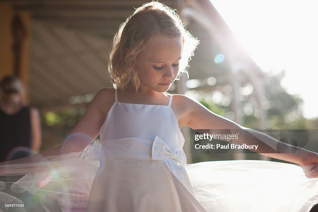 Flower girl with arms outstretched