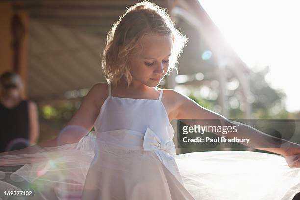 flower girl with arms outstretched - girls dress stock pictures, royalty-free photos & images