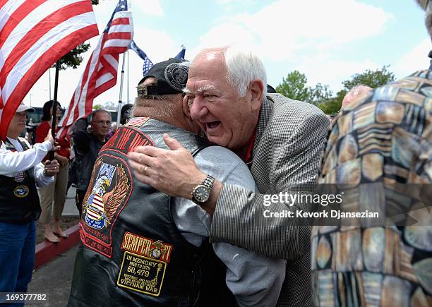 Vietnam POW retired as a Lieutenant Colone U.S. Marine Corps Orson Swindle hugs Vietnam veteran Jim Janeway as he arrives on May 23, 2013 in Yorba...