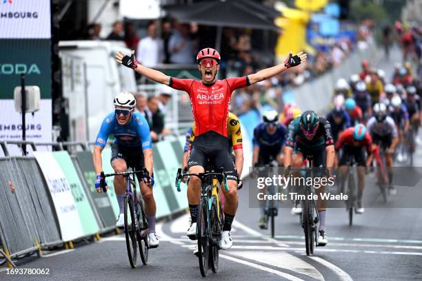 Jenthe Biermans of Belgium and Team Arkea Samsic celebrates at finish line as stage winner ahead of Soren Kragh Andersen of Denmark and Team...